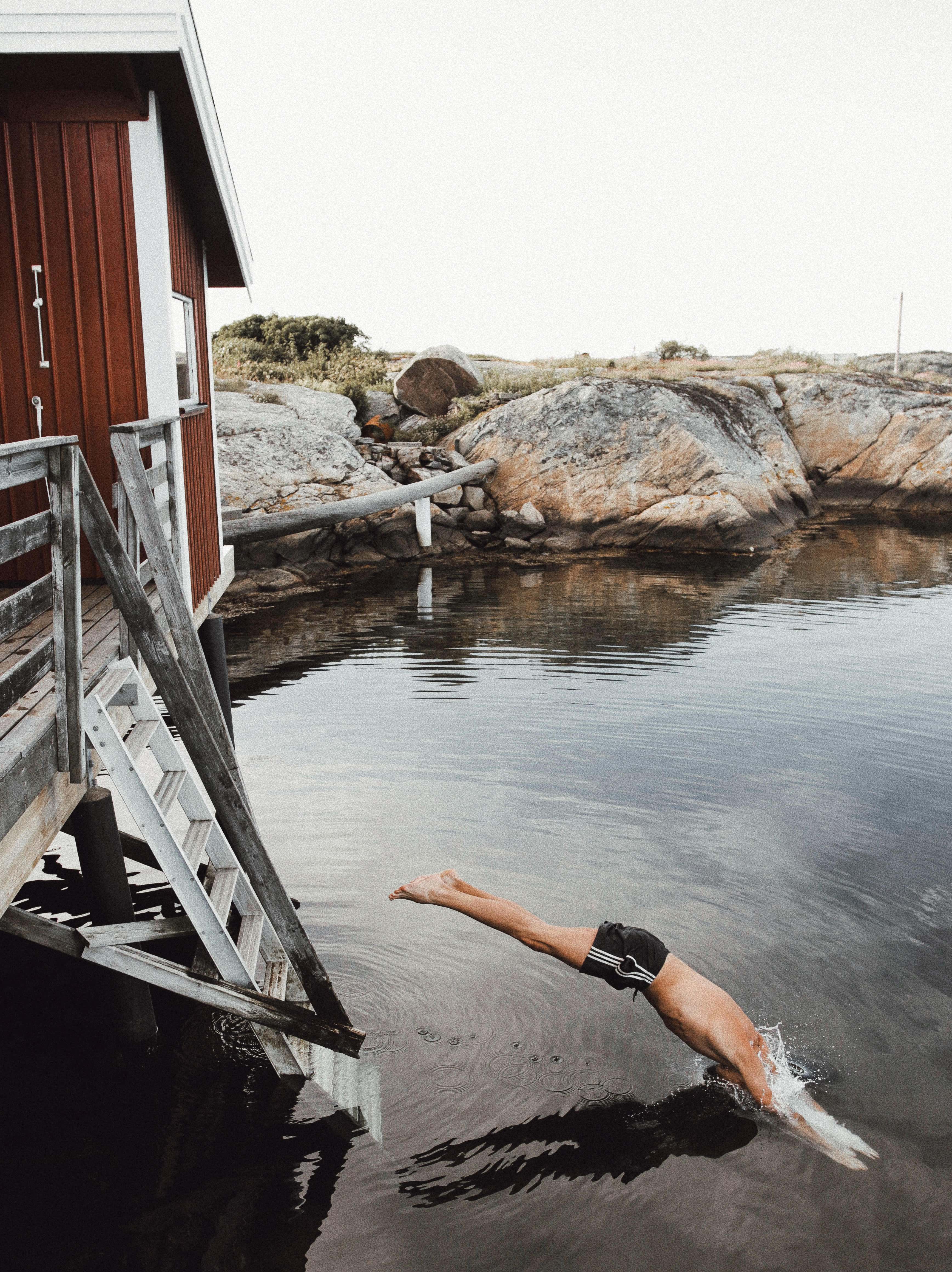 Diving in lake in Sweden by Louise Whitehouse photographer